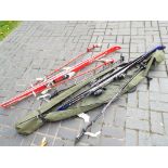 An Adventure Centre waterproof bag containing a pair of Head H24X skis and skiing poles,