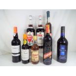 Eight bottles of alcoholic beverages to include Pimms, Harveys Bristol Cream, Dubonnet,