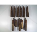 Eleven 33mm canon shells