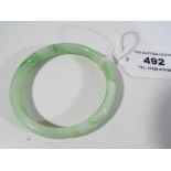 A jade bangle Est £30 - £50