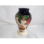 Moorcroft Pottery - a Moorcroft Pottery vase in the Anna Lily pattern,