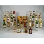 Twenty five miniatures / taster bottles of Scotch whisky to include Black Adder 18 year old,