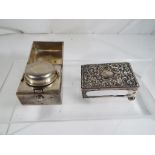 A Victorian silver hallmarked travelling inkwell, containing glass well,