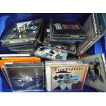 A lot to include a quantity of CDs comprising Cream, Pet Shop Boys, The Police, Amy Winehouse,