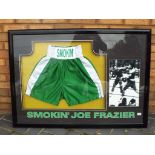 Smokin' Joe Frazier - a pair of green boxing shorts signed in black marker 'Joe Frazier' World