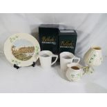 Belleek - Five pieces of Belleek to include a tea light holder and stand (boxed), a pair of mugs,