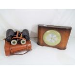 A Town Savings Clock (Two Florins Weekly) and a pair of Orpheus 7 x 50 zoom binoculars with carry