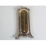 An Edward VII hallmarked silver framed thermometer, Birmingham assay 1902, 15.