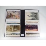 A postcard album containing a collection of cards from WWI and later