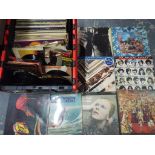 A large quantity of 33 RPM and 45 RPM vinyl records to include The Beatles, The Rolling Stones,