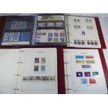 Philately - four albums containing a quantity of mint stamps,