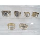 Five hallmarked silver napkin rings, various assay marks,