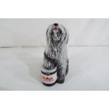 A Royal Doulton Dulux dog.