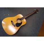 A 6 string Tanglewood acoustic guitar Model No.