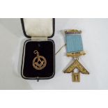 A 9 ct gold hallmarked Masonic fob (5.27 grams all in) with gilt Masonic medallion marked silver.