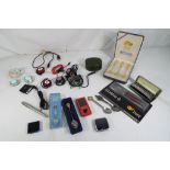 A good mixed lot to include a small quantity of crested spoons, a harmonica in protective case,