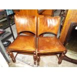 A pair of good early period chairs having brown leather backs and seats [2]
