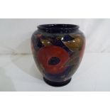 Moorcroft Pottery - a Moorcroft Pottery vase decorated with pomegranate,