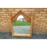 An unusual wooden framed hall mirror,