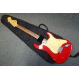 A 6 string electric acoustic guitar by Squire Strat by Fender,