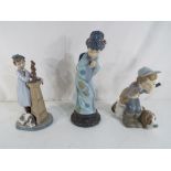 Lladro - three Lladro figurines comprising #4971 Hunter Puppet, #4989 Japanese Sayonara and #5358,