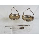 A matched pair of hallmarked silver openwork bonbon dishes with handles, Sheffield assay,