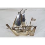 A sterling silver miniature sailing boat, 9.