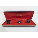 Masonic - a boxed pair of cuff links with tie clip relating to the Masons