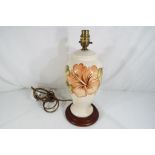 Moorcroft Pottery - a large Moorcroft pottery lamp base decorated with hibiscus on a cream ground