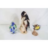 Two Goebel bird figurines to include Blue Tit and Great Spotted Woodpecker,