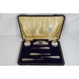 A George V hallmarked silver mounted, cased manicure set, Birmingham assay 1919.