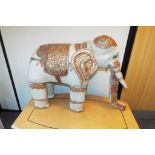 An early 20th century puppet in the style of an articulated elephant,