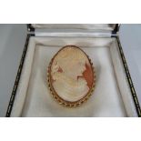 A lady's 9 ct gold hallmarked cameo brooch contained in a case.