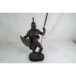 A bronze figure depicting a soldier on an Italian marble plinth,