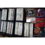 Seven record carry cases containing a large quantity of 33 RPM vinyl records to include Johnny Cash,