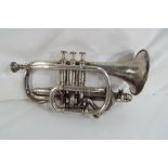A silver coloured trumpet inscribed to the body J R Lafleur & Son, 47 Wardour Street,