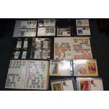 Philately - Three binders containing a quantity of first day covers and stamp books,