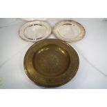 Two George Jensen silver plated stainless steel platters approximately 31 cm diameter and one brass