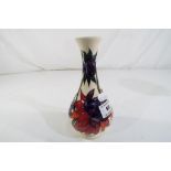 A Moorcroft Ruby Red vase, approx 15 cm (h).