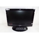 An 18 inch flat screen Tevion television with remote control and power lead