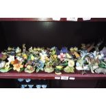 A quantity of bird and butterfly figurines and other animals to include Goebel, Ainsley and similar.