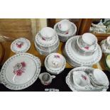 A lot to include a quantity of Hira American Rose china, 63 pieces in total comprising plates, cups,