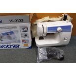 A Brother sewing machine model #LS-2125 with manual, power controller pedal,