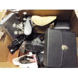 A quantity of vintage cameras and binoculars to include Olympus OM10, Box Brownie,