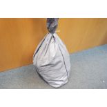 A large sealed sack of unsorted costume jewellery,