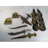 A collection of brass items to include horse brasses,