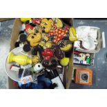 A mixed lot of Disney and Snoopy related items to include cuddly toys, cups, posters,