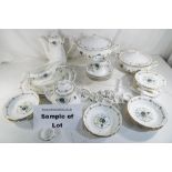 An Argyle dinner service with floral and gilt decoration comprising plates, cups, saucers,