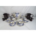 A Royal Cauldon coffee set and four pewter tankards (qty)