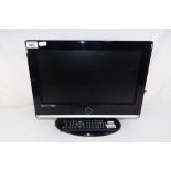 A 15 inch Logik flat screen television with power lead and remote control